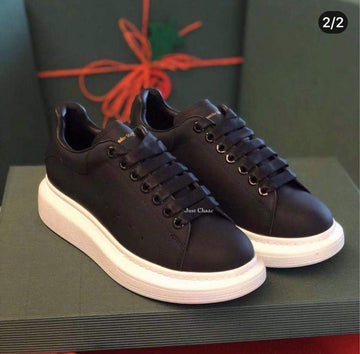 Stylish Black Leather Sneakers with Bold Design